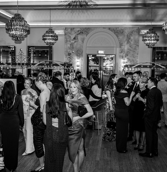 welcome guests under the grands twinkling chandeliers